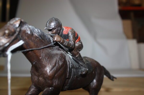 Jockey on horse - Bronze Statue -  Size: 11"L x 4"W x 8"H.