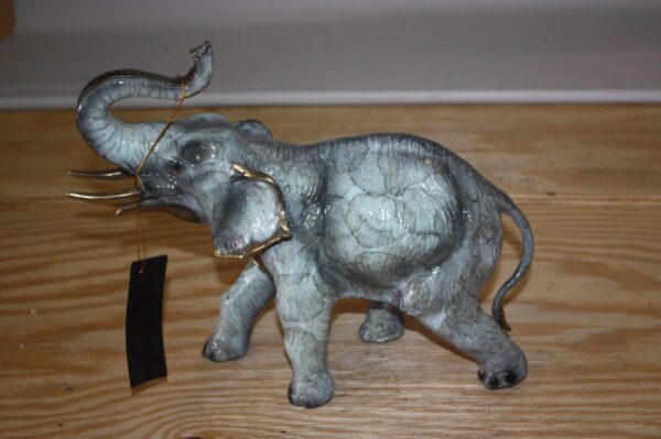 Elephant with trunk up -  Statue -  Size: 13.5"L x 5"W x 12"H.