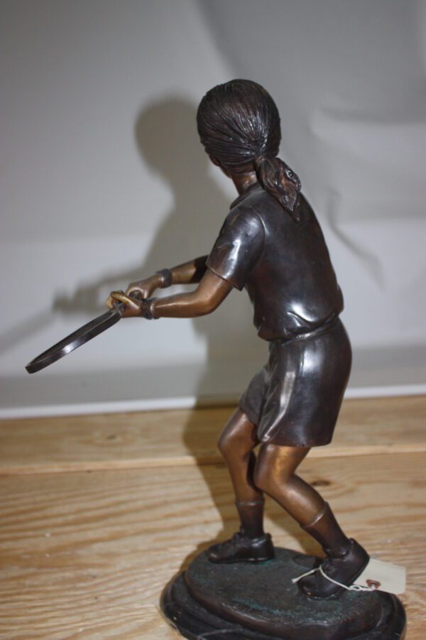 Girl Playing Tennis - Bronze Statue -  Size: 10"L x 11"W x 21"H.