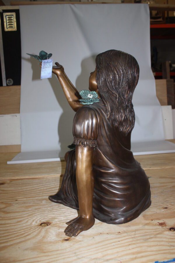 Girl with butterflies  - Bronze Statue -  Size: 27"L x 17"W x 24"H.