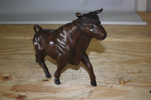 Bull Head up - Bronze Statue -  Size: 15"L x 4"W x 10"H.