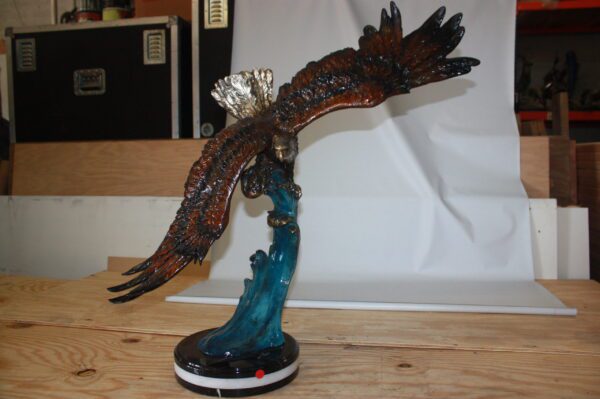 Eagle on a wave - Bronze Statue -  Size: 32"L x 12"W x 34"H.