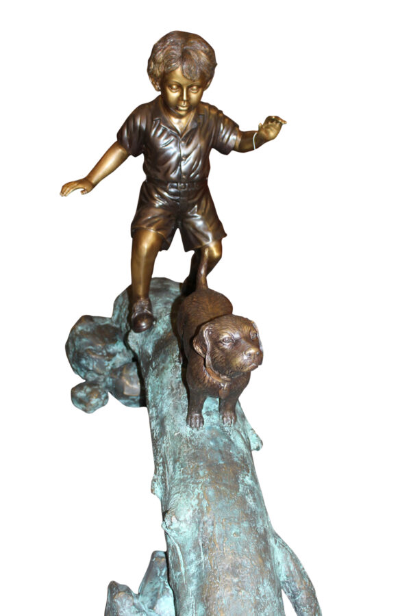 Kid with dog walking on a log Bronze Statue -  Size: 57"L x 18"W x 41"H.