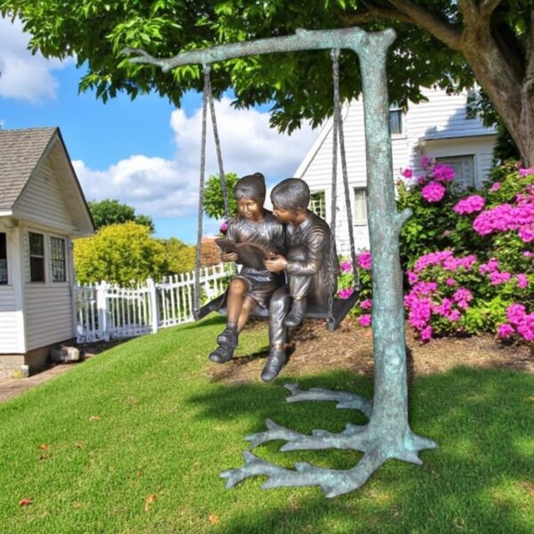 Kids on Swing Set Reading a Book Life Size Bronze Statue -  50"L x 40"W x 70"H. - Image 3