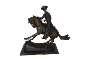 Remington Cowboy on marble Bronze Statue -  Size: 24"L x 9"W x 23"H.