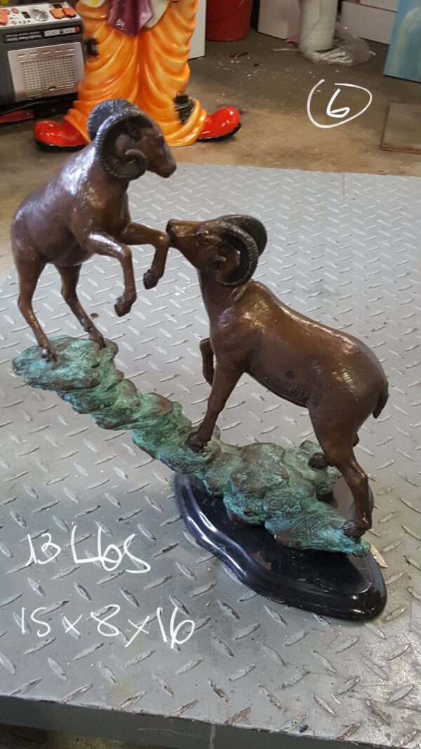 Two Rams on a rock Bronze Statue -  Size: 15"L x 8"W x 16"H.