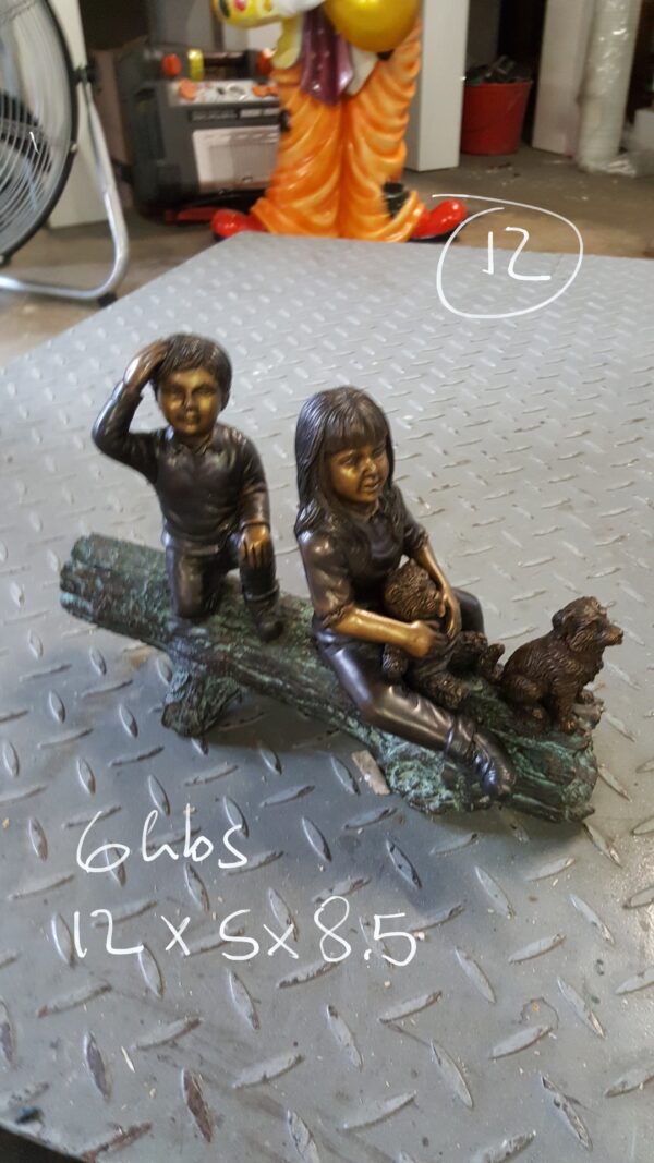 Two kids with dog on log Bronze Statue -  Size: 12"L x 5"W x 8.5"H.