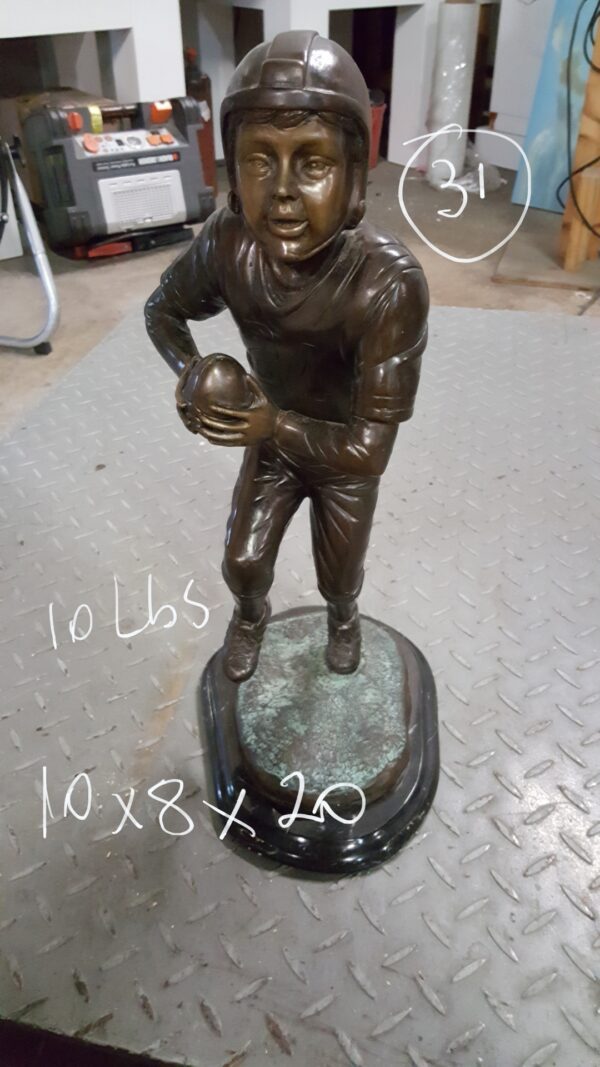 Boy playing football Bronze Statue -  Size: 10"L x 8"W x 20"H.