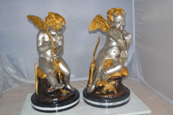 Cupid Girl On A Rock Bronze Statue  -  Size: 20"L x 15"W x 25"H.