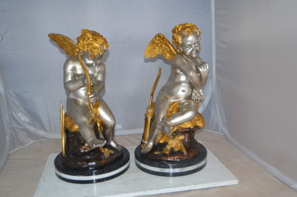 Cupid Girl On A Rock Bronze Statue  -  Size: 20"L x 15"W x 25"H.