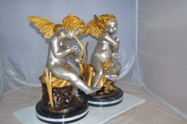 Cupid Girl On A Rock Bronze Statue  -  Size: 20"L x 15"W x 25"H.