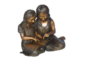 Two Girls Reading a Book Bronze Statue -  Size: 33"L x 21"W x 23"H.
