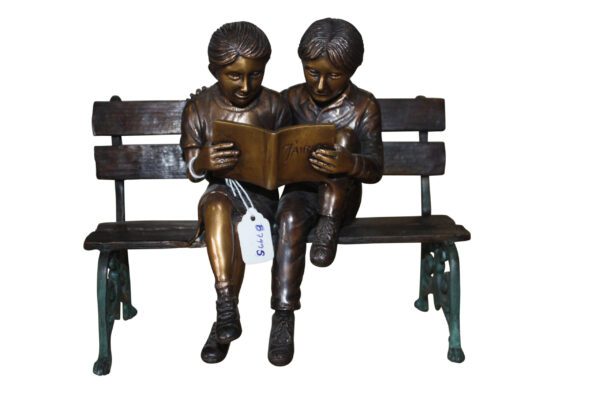 Two kids on bench reading a book - Bronze Statue -  Size: 9"L x 6"W x 8"H.