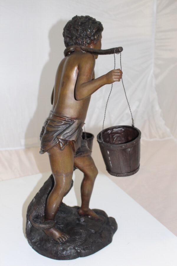 Boy with two buckets Bronze Statue -  Size: 14.5"L x 10"W x 23"H.