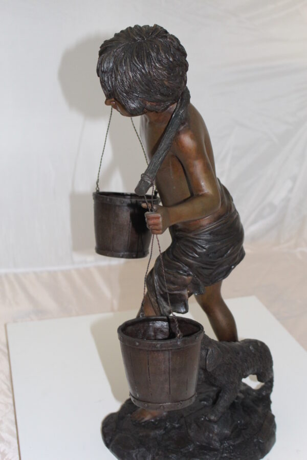 Boy with two buckets Bronze Statue -  Size: 14.5"L x 10"W x 23"H.