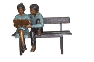 Boy and a Girl on Bench reading book bronze Statue -  Size: 43"L x 20"W x 36"H.