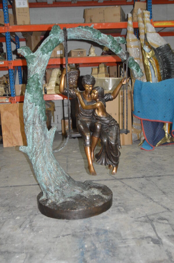 Lovers on a Swing Bronze Statue -  Size: 48"L x 32"W x 64"H. - Image 2