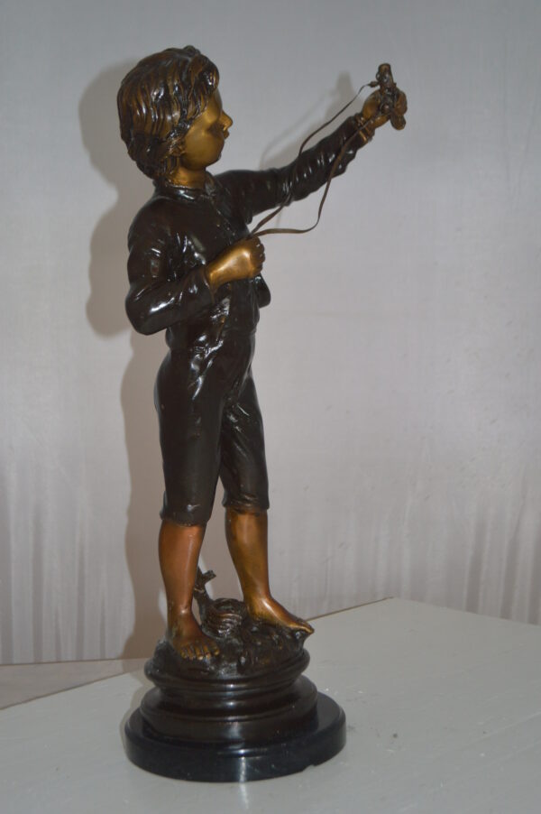 Boy with a Slingshot Bronze Statue -  Size: 12"L x 7"W x 21"H. - Image 4