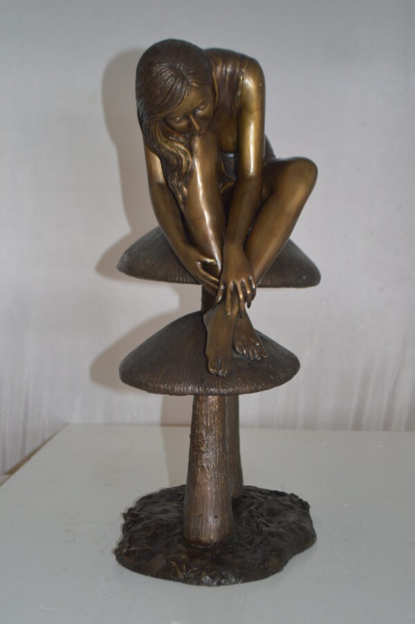 Girl sitting on Mushrooms Bronze Statue -  Size: 13"L x 11"W x 18"H. - Image 5