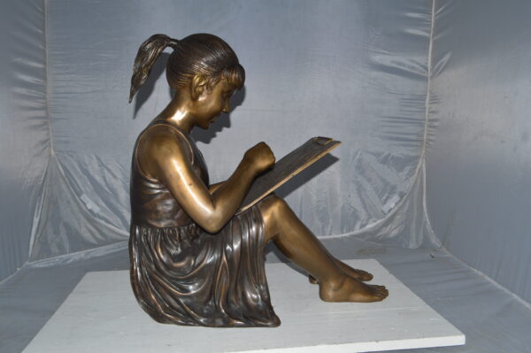Girl reading from a notebook Bronze Statue -  Size: 26"L x 16"W x 25"H. - Image 6