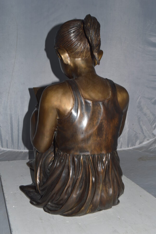 Girl reading from a notebook Bronze Statue -  Size: 26"L x 16"W x 25"H. - Image 8