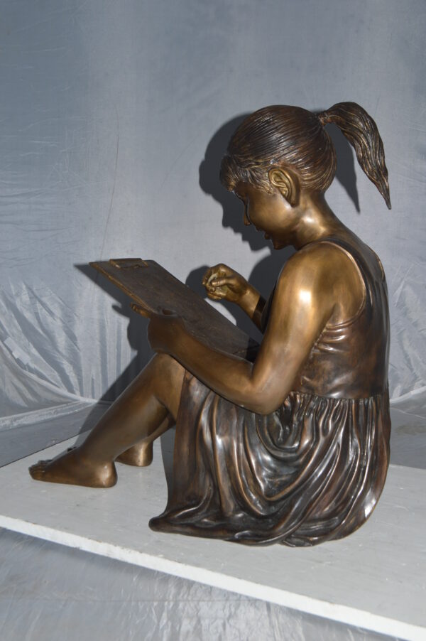 Girl reading from a notebook Bronze Statue -  Size: 26"L x 16"W x 25"H. - Image 9