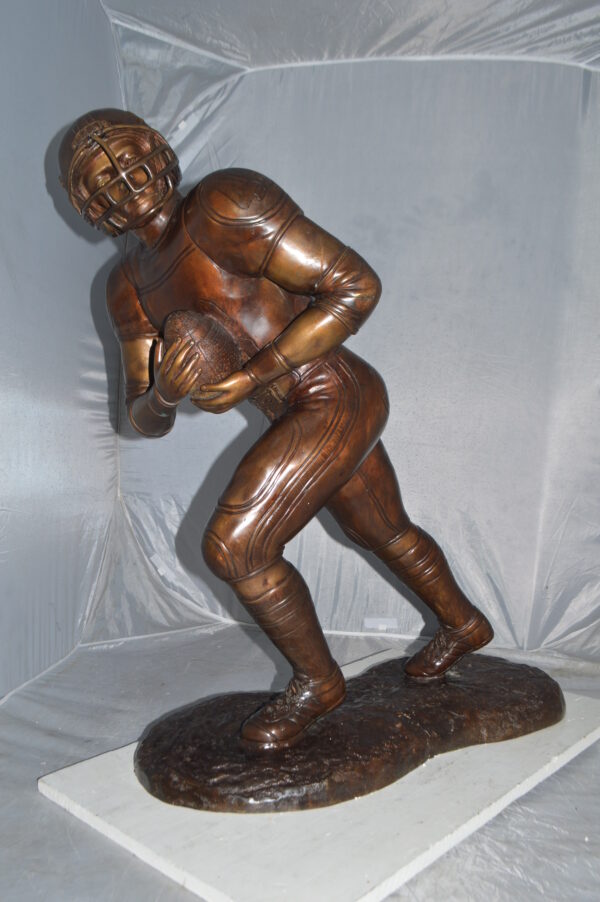 Football player Bronze Statue -  Size: 30"L x 12"W x 36"H. - Image 2