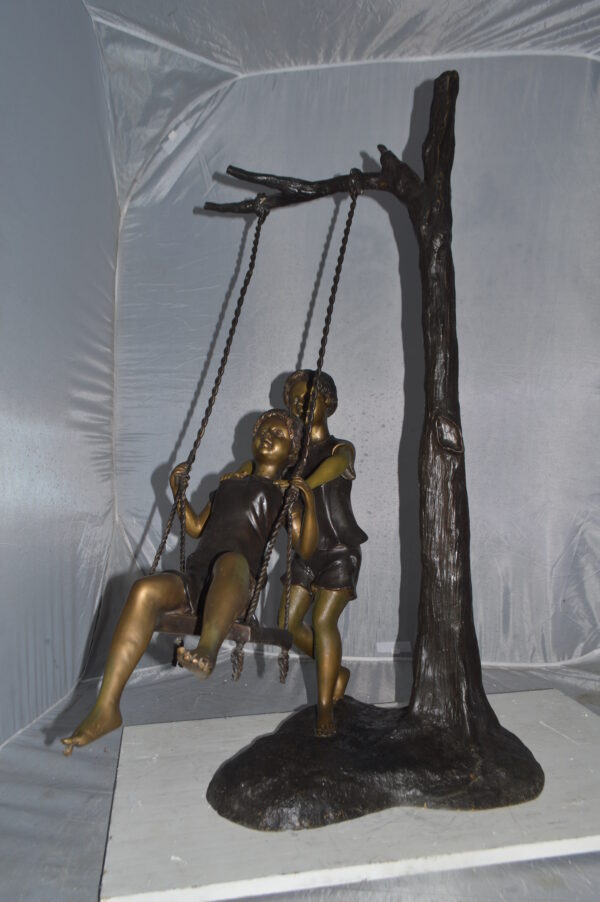 Kids Playing on a Swing bronze Statue -  Size: 22"L x 25"W x 43"H. - Image 3