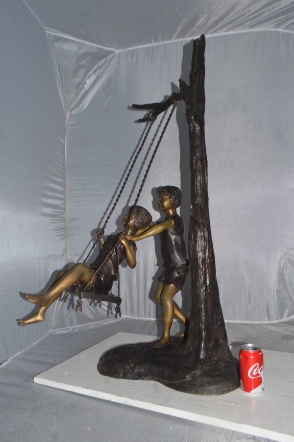 Kids Playing on a Swing bronze Statue -  Size: 22"L x 25"W x 43"H. - Image 4