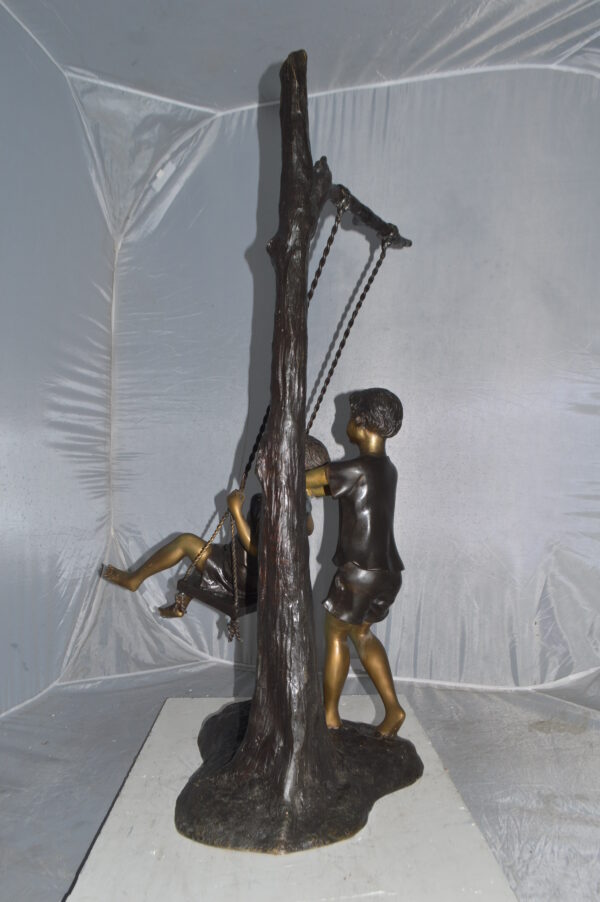Kids Playing on a Swing bronze Statue -  Size: 22"L x 25"W x 43"H. - Image 5