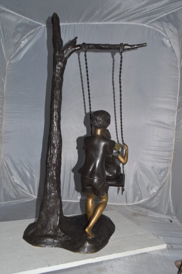 Kids Playing on a Swing bronze Statue -  Size: 22"L x 25"W x 43"H. - Image 6