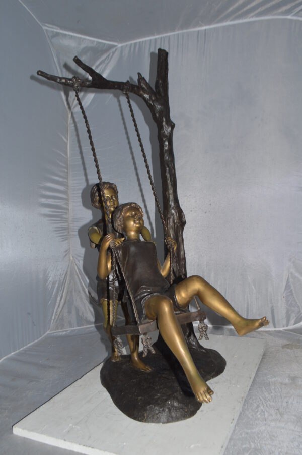 Kids Playing on a Swing bronze Statue -  Size: 22"L x 25"W x 43"H. - Image 8