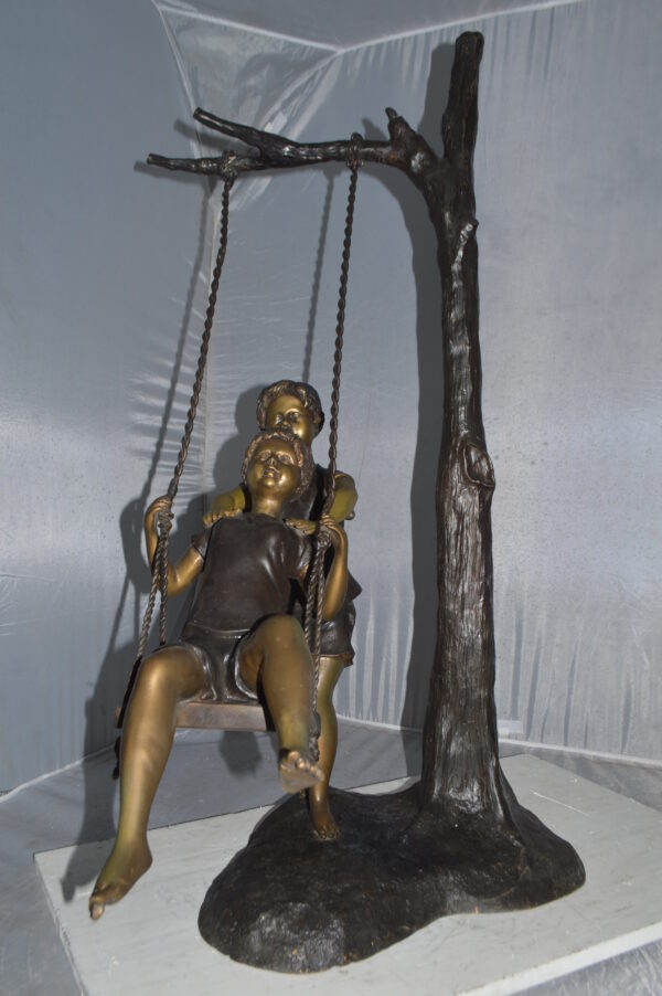Kids Playing on a Swing bronze Statue -  Size: 22"L x 25"W x 43"H. - Image 10