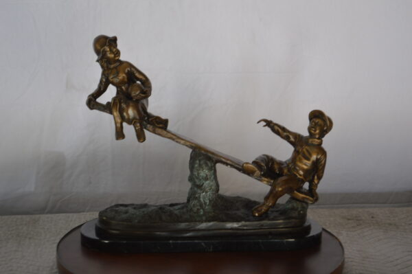 Boys Playing Seesaw on a Marble Base Bronze Statue -  Size: 22"L x 8"W x 17"H. - Image 3