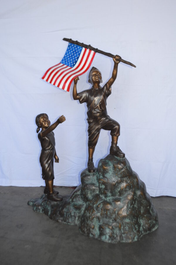 Two Kids on Rock W the American Flag Bronze Statue -  Size: 50"L x 22"W x 58"H. - Image 4