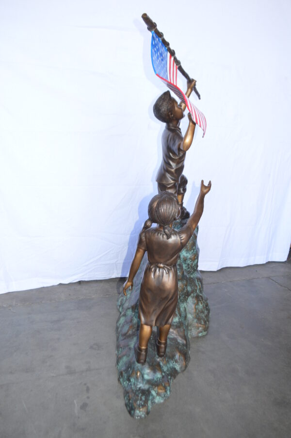 Two Kids on Rock W the American Flag Bronze Statue -  Size: 50"L x 22"W x 58"H. - Image 9