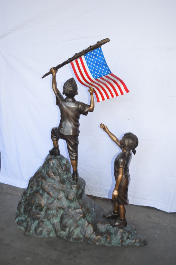 Two Kids on Rock W the American Flag Bronze Statue -  Size: 50"L x 22"W x 58"H. - Image 10