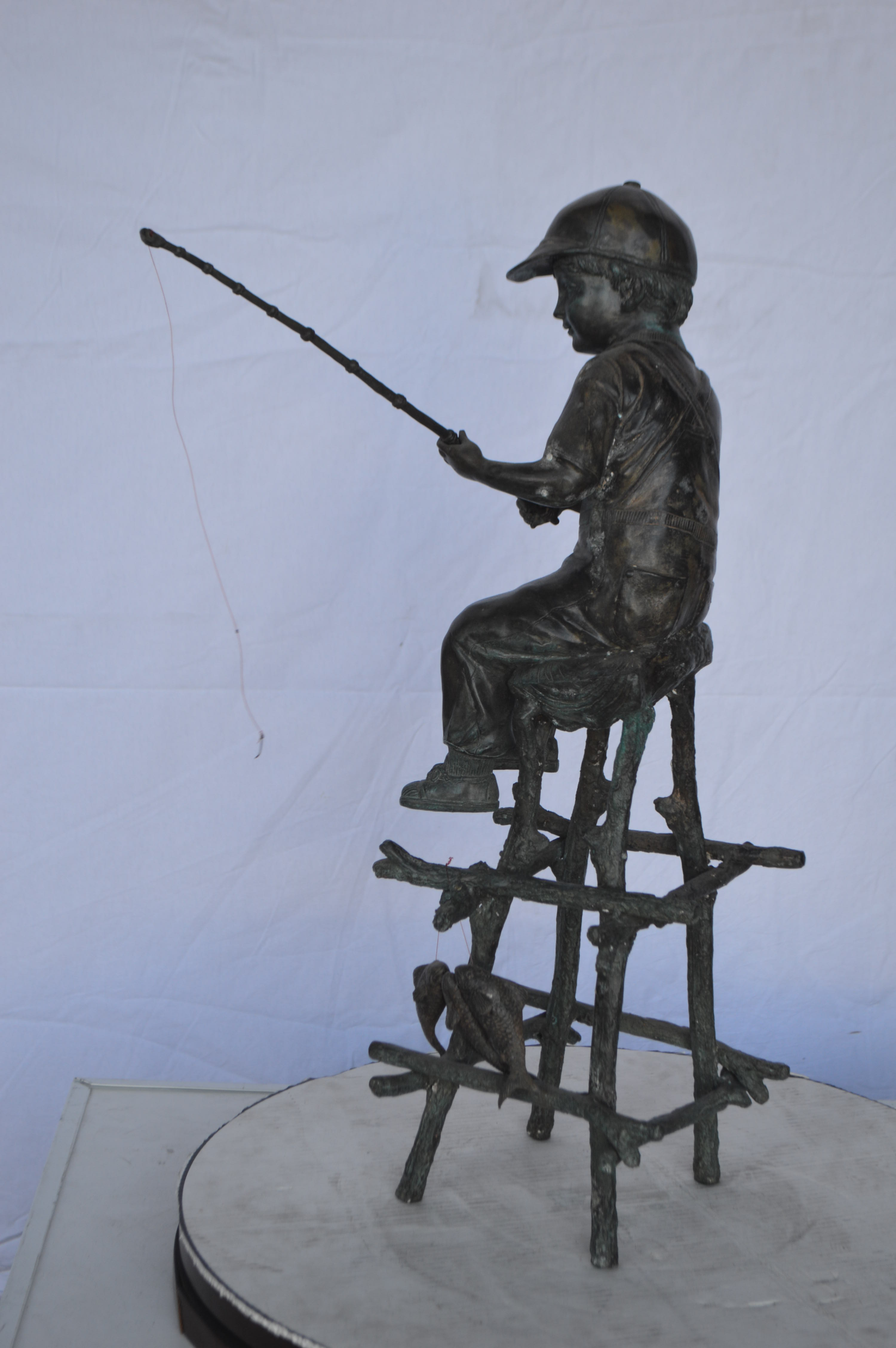 A Boy on a high Chair Fishing Bronze Statue Size 16"L x