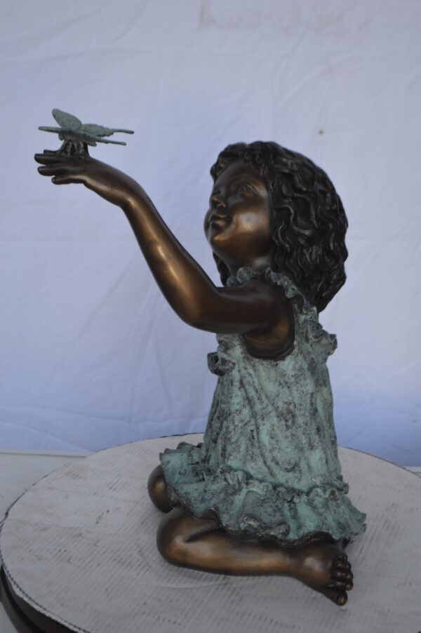 Girl Playing With Butterfly Bronze Statue -  Size: 21"L x 15"W x 19"H. - Image 6