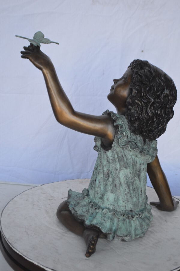 Girl Playing With Butterfly Bronze Statue -  Size: 21"L x 15"W x 19"H. - Image 7