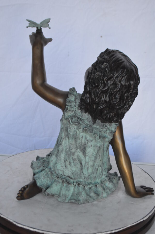 Girl Playing With Butterfly Bronze Statue -  Size: 21"L x 15"W x 19"H. - Image 8