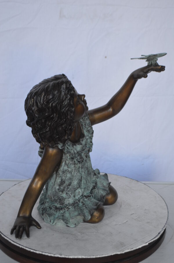 Girl Playing With Butterfly Bronze Statue -  Size: 21"L x 15"W x 19"H. - Image 10