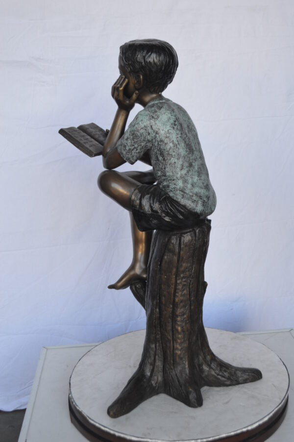 Boy Sitting on a Stump Reading a Book -  Size: 18"L x 20"W x 35"H. - Image 6