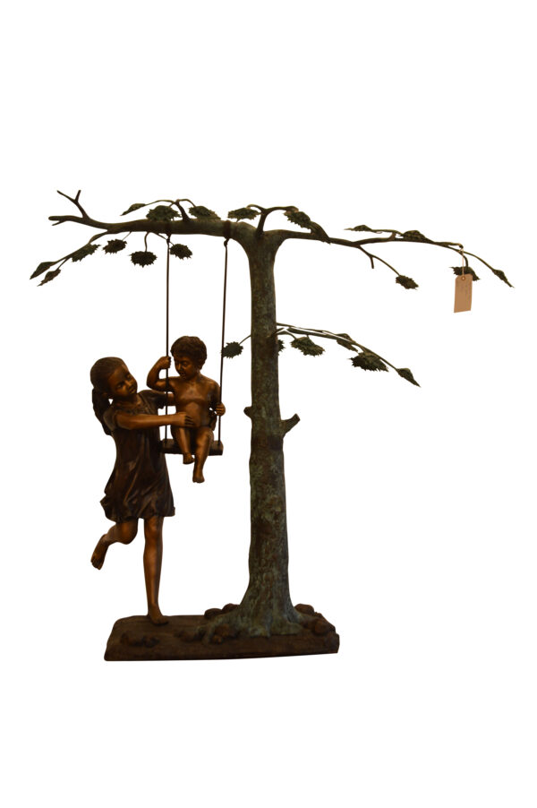 Swing Set Under A Three Bronze Statue -  Size: 60"L x 33"W x 60"H.