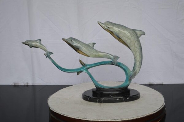 Three dolphins swimming bronze state -  Size: 26"L x 7"W x 16"H. - Image 2