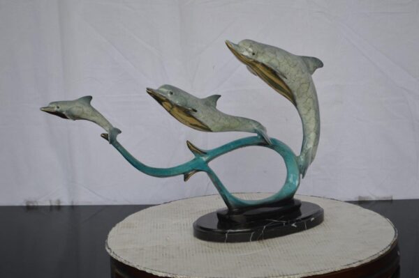 Three dolphins swimming bronze state -  Size: 26"L x 7"W x 16"H. - Image 3