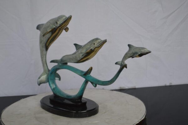 Three dolphins swimming bronze state -  Size: 26"L x 7"W x 16"H. - Image 5