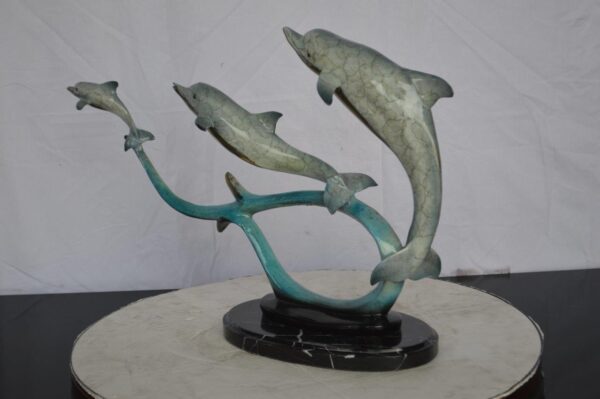 Three dolphins swimming bronze state -  Size: 26"L x 7"W x 16"H. - Image 10