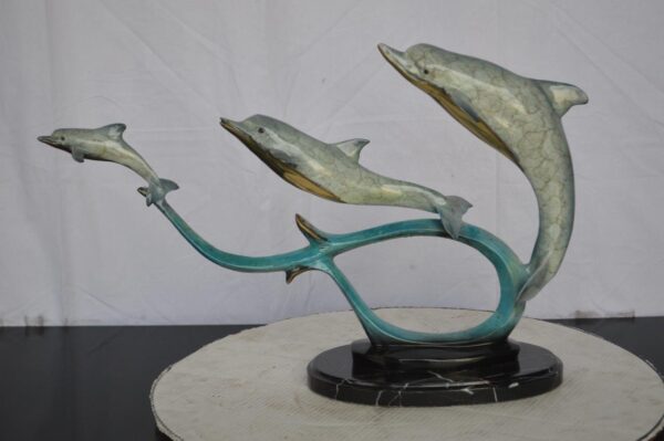 Three dolphins swimming bronze state -  Size: 26"L x 7"W x 16"H. - Image 11
