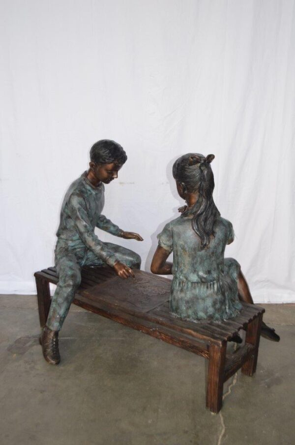 Young Couple Reviewing a World Map Bronze Statue -  Size: 32"L x 47"W x 42"H. - Image 8